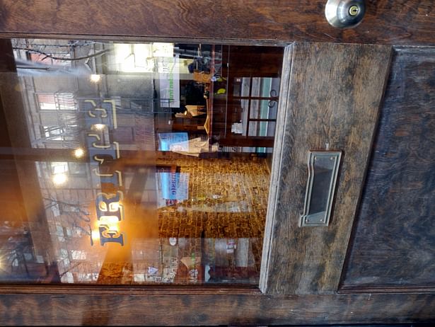 Door Restaurant interior design bricks reclaimed wood lighting faux-paint