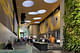 The David Rubenstein Atrium at Lincoln Center in New York City, which cobbles together 7,000 square feet of new public space for performances and Lincoln Center visitors out of the interstitial spaces between buildings. Newcomers and Lincoln Center regulars are treated to a 20-foot tall green wall and 16 skylight oculi, playfully scattered across the ceiling. (Image via twbta.com)