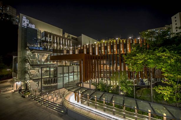 The theatre at night is a glowing lantern for the community