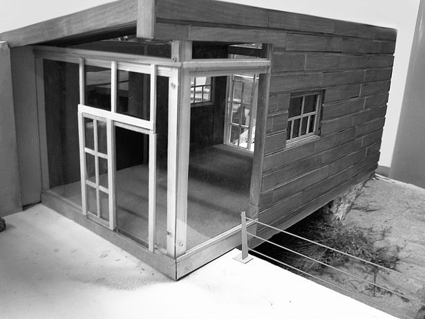 Image show the main entry to the house off the front porch. 