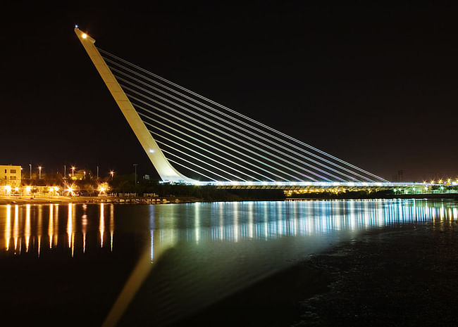 The Alamillo Bridge in Seville, Spain at night (via Wikipedia)