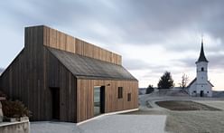 Between a 16th century church and a wooden barn: the Chimney House by dekleva gregorič architects