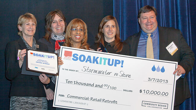 “Stormwater reStore” Team of Christopher Gubeno, Urban Engineers, Inc. (far right) and Johanna Phelps, Matthew Nielsen Landscape Architects (second from right) accept award for Commercial: Retail Retrofit category © CG Lawrence Photography (Gregory Clarke)