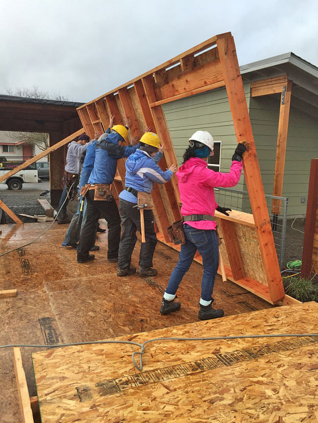 With the subfloor completed, students in the OregonBILDS studio frame and lift exterior walls into place. The BILDS house will be sold to an income-qualified family.