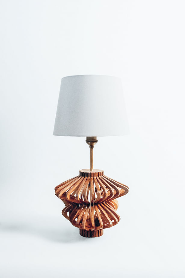 Overall shot - The Final lamp is milled from Black Walnut at 1/4' thick and is hand assembled. After the form is completed it is then finished using a clear stain called 'the good stuff'.