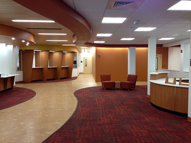 Lobby space with check-in kiosks, recpetion and lounge areas