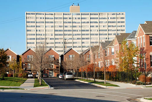 Old Town Village West townhomes, a new mixed-income development, ca. 2009; looming in the background is the William Green Homes high-rise, part of Cabrini-Green, demolished 2011. [Photo: Lawrence J. Vale]