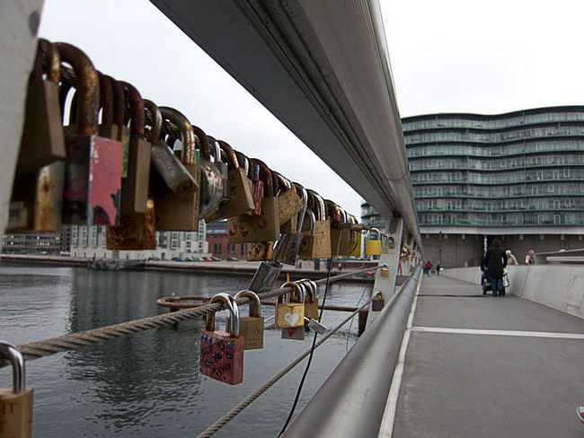 Padlocks, keylocks and combination locks string a bridge in Copenhagen