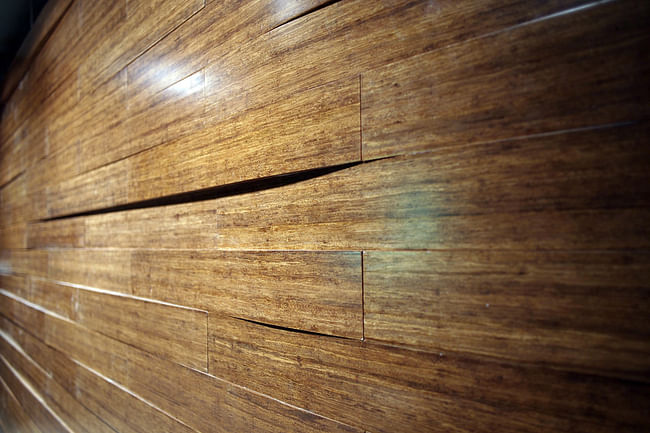 A close-up of the solid bamboo block walls in the main auditorium. (Photo: Martin Lukasczyk)