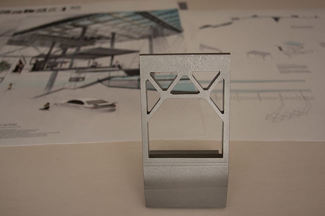 Bay Bridge House trophy with winning proposal in the background. Image courtesy of Bay Bridge House.