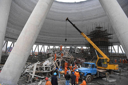 In this photo released by Xinhua News Agency, rescue workers look for survivors after a work platform collapsed at the Fengcheng power plant in eastern China's Jiangxi Province, Thursday, Nov. 24, 2016. State media reported dozens were killed after the scaffolding tumbled down. (Wan Xiang/Xinhua via AP)