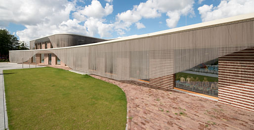 backside with the iron curtains that lead rainwater into gray water circuit