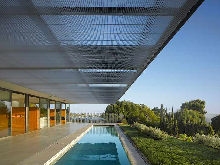 A large trellace provides shade and privacy for the homeowners. Image courtesy of SPF:architects