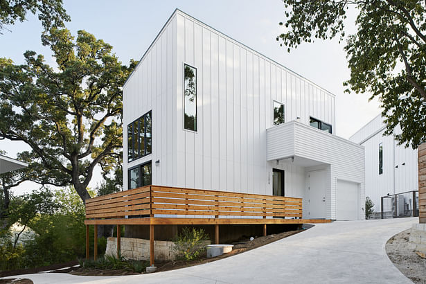 In working with a limited budget and economical materials, we placed extra attention on massing and fenestration. This particular house is 850 square feet of living space and includes two bedrooms and one and half baths. Simplicity of form with dynamic elements and limited use of color creates an impactful form without being overly dramatic. 