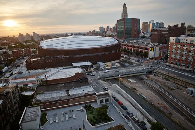 As the sun sets over the Barclays Center arena, a new era is about to begin. The developer says that the 16 towers planned around the arena – almost all residential – will eventually be built in two phases, and the project goals of “Jobs, Housing, Hoops” will be fulfilled. Credit: Victor J. Blue for The New York Times