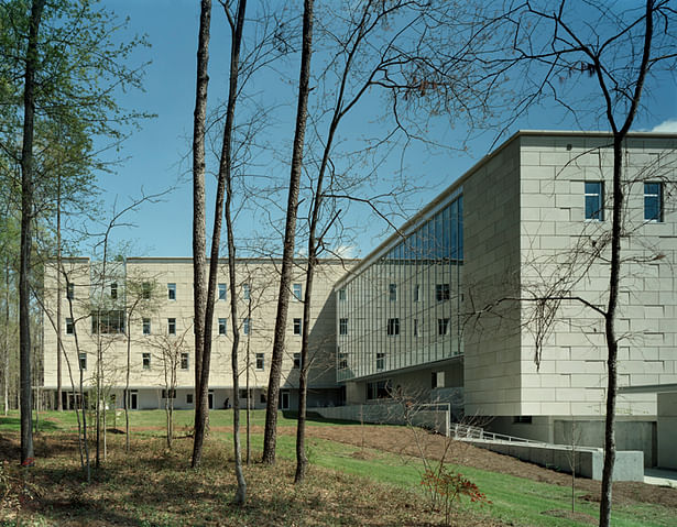 View from the west showing the shadowed plinth that shelters employees as they approach from parking areas.