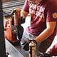 in Blacksburg, everyone was hard at work ms with a mag drill and planing wood for thdrilling holes in the steel beae handrails and guardrails via design/buildLAB