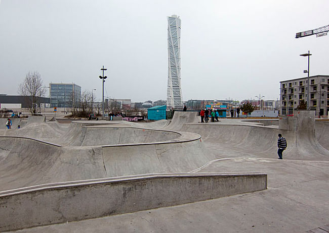 Turning Torso in the background of a community skate park