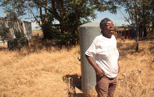 Flossie Ford-Hedrington stands beside her well, which stopped producing water last year (Sasha Abramsky). Image via thenation.com.