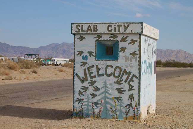 A welcome-sign at the entrance to Slab City. Credit: Wikipedia