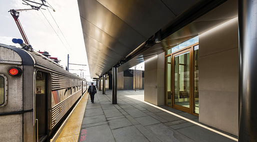 blackened stainless steel canopy over the railroad platform