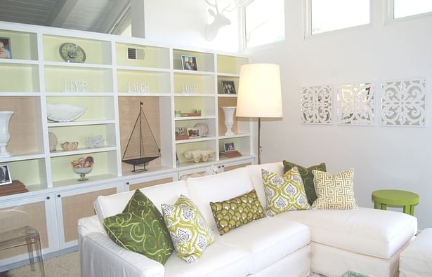 sunroom styled with custom paint & wallpapered shelves