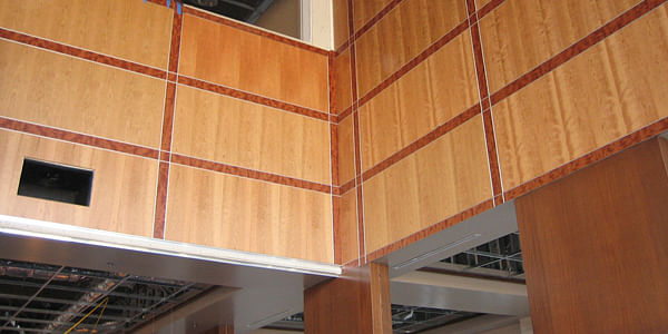 Cherry, Mahogany, and Stainless Steel Paneling Under Construction