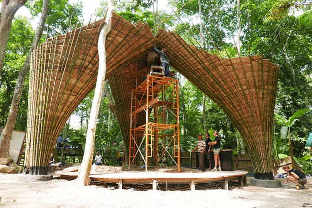 Roof canopy is constructed through weaving palm thatch into bamboo