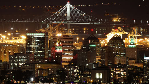OAKLAND, CA, USA - Night Skyline with Bay Bridge. Image via Wikipedia.