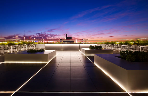 Sunrise on the Skyline roof deck. The square pattern of the LED lights connects to the construction grid of the entire building.