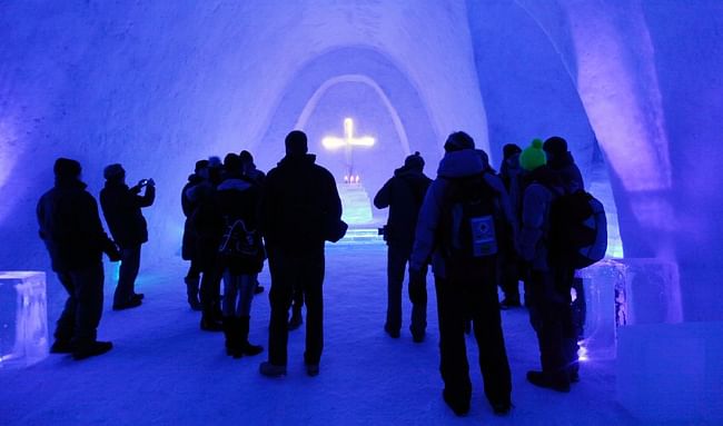  Blue lighting elements are built into the ice, giving the church a stunning color via Reuters