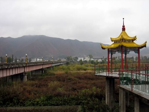 Bridge near the border town of Tumen City linking China with North Korea in the background. Photo: Prince Roy/Flickr