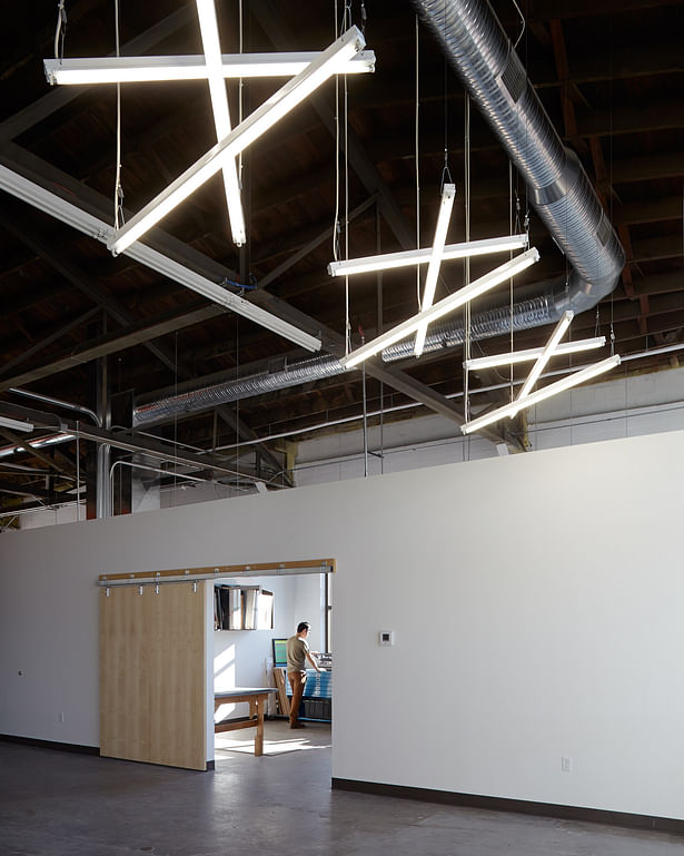 unique lighting design helped to break up the space of this vast industrial building