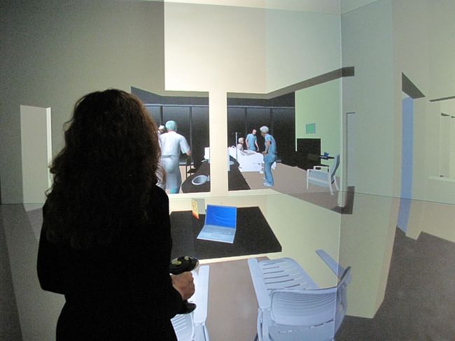 Dr. Eve Edelstein of NSAD, in a full-scale 3D hospital mockup in the virtual reality StarCAVE at Calit2/UCSD, assesses clinical avatars evidence-based design to minimize medical errors. Photo credit: Erick Jepsen, Calit2/UCSD. 