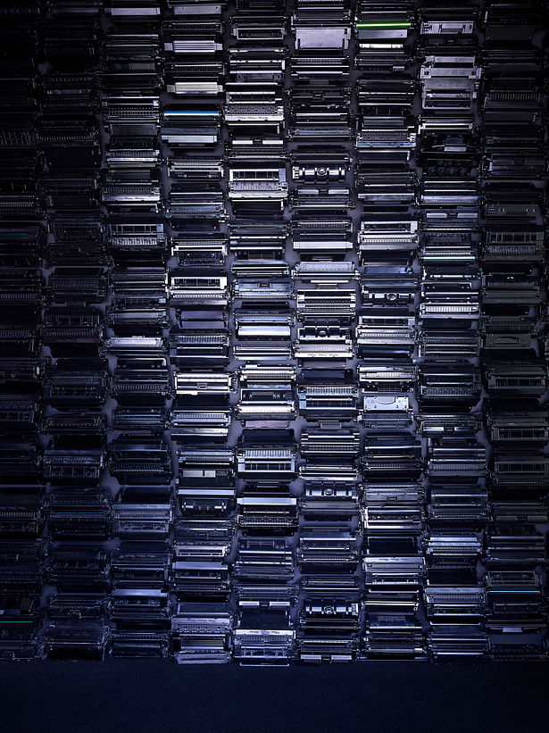 A wall of recycled toner cartridges references the waste associated with printing today. Recycling 1 cartridge saves 3.6 lbs. of solid waste. En masse they create a unique texture and emphasize that beauty can come from unexpected places. 