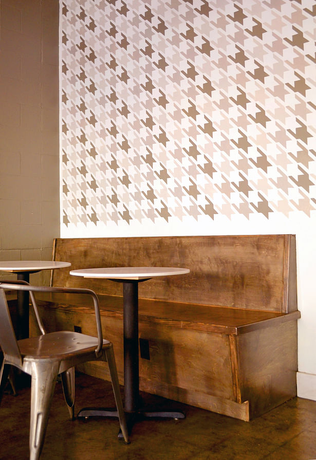 We designed a new built in bench and a houndstooth mural for the cafe