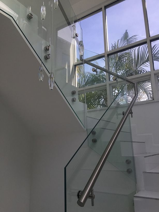 Laminated glass panels were side mounted with stainless steel standoffs.