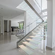 Our Cantilevered Staircase Design Features Frosted Glass Treads with LED Lighting!