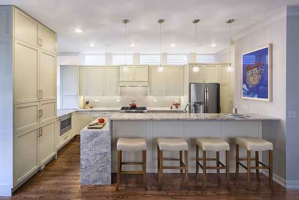 View from dining room, incorporating clerestory windows above the upper cabinets to contribute to sense of openness. Photo by David Seide, Defined Space.