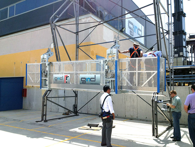 'The façade’s unique geometry demands a strategic design for the window washing system. The employed solution features a conventional track, torpedo, and gondola system adapted to move freely over the undulating curves of the façade, to transition easily from vertical to pleated façade, and to glide across stack joint conditions without jamming or inflicting damage.' Image courtesy of REX.