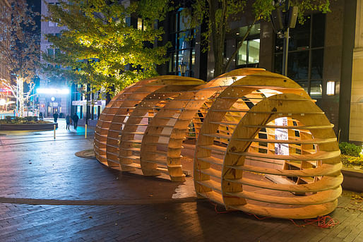 Snowball Pavilion - exterior. A single 10’ x 35’ wood frame is designed to accumulate snow, creating an internal warm glow. Photo credit: www.GregoryWilsonPhoto.com