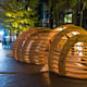 Snowball Pavilion - exterior. A single 10’ x 35’ wood frame is designed to accumulate snow, creating an internal warm glow. Photo credit: www.GregoryWilsonPhoto.com