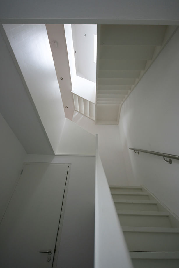 Stairs with void and roof light. 