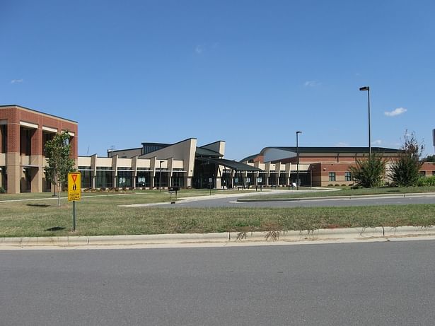 Front elevation, with (L-R) Media Center, Admin., Entry, Commons, Athletics.