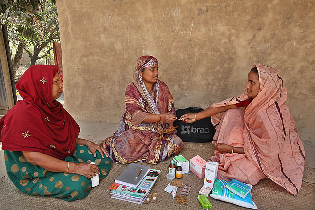 Shasthya Shebika (Health Volunteer) Kit: BRAC. Bangladesh, 1977-present. Medicine, sanitary napkins, delivery kit, soap, salt, registrar to maintain records, pictorial dosage instructions. Photo: © BRAC 