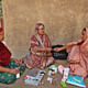 Shasthya Shebika (Health Volunteer) Kit: BRAC. Bangladesh, 1977-present. Medicine, sanitary napkins, delivery kit, soap, salt, registrar to maintain records, pictorial dosage instructions. Photo: © BRAC 