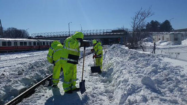 MBTA workers shovel snow in Boston. Credit: MBTA