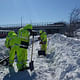MBTA workers shovel snow in Boston. Credit: MBTA