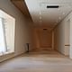 A large window with bench seating is seen though out the expansion in the San Francisco Museum of Modern Art (photo by Lea Suzuki, The SF Chronicle)