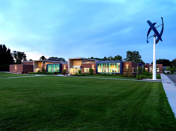 Evening View with Wind Turbine: The John C. Dunham STEM Partnership School, Cordogan Clark & Associates